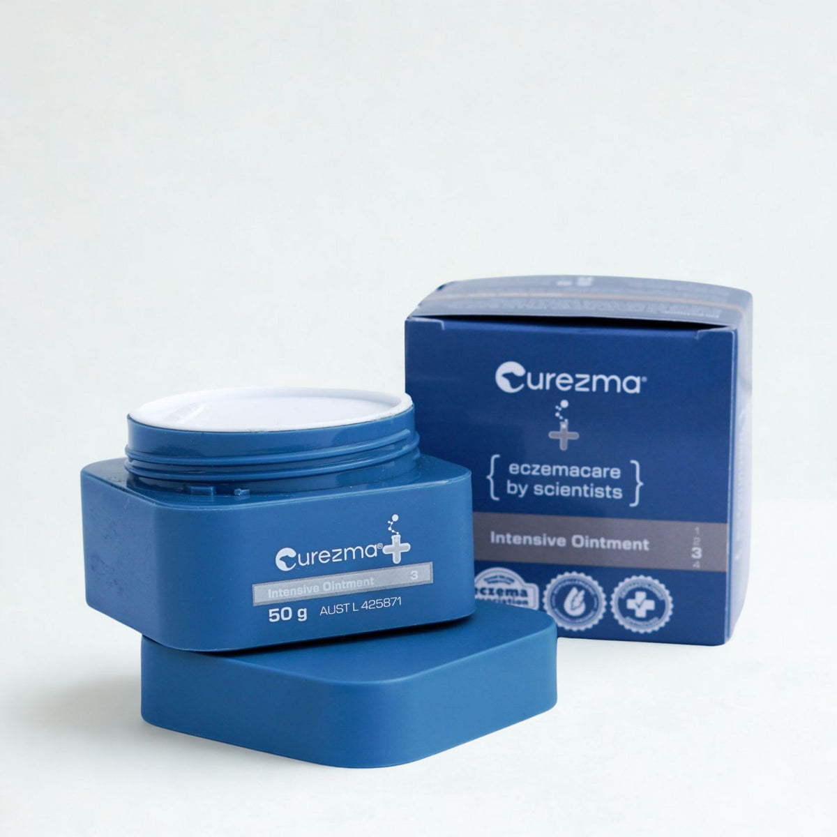Curezma Intensive Ointment jar and packaging on a white background