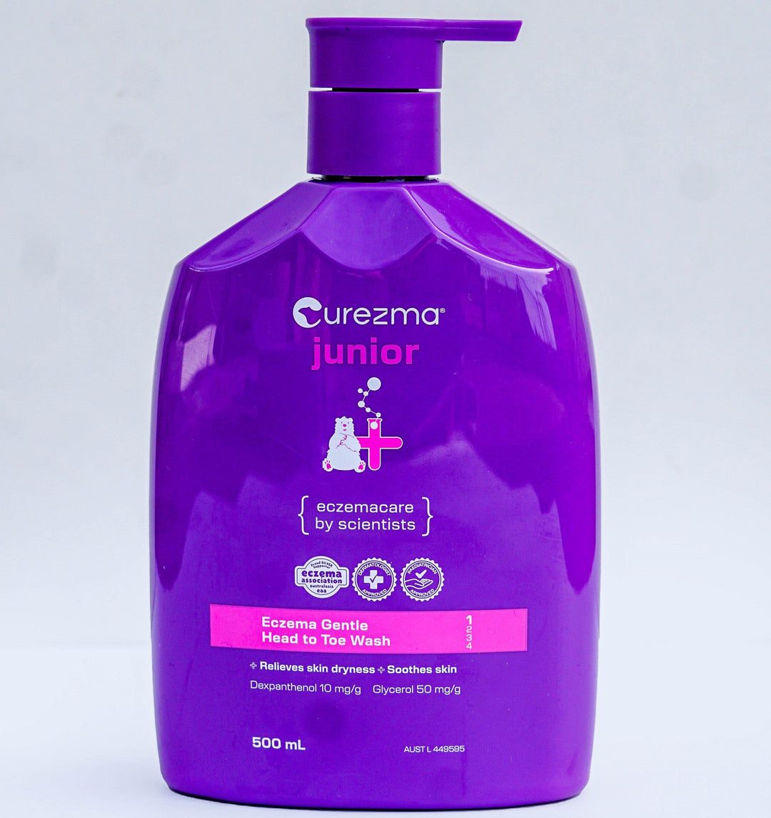 Purple bottle of Curezma Junior on a light gray background