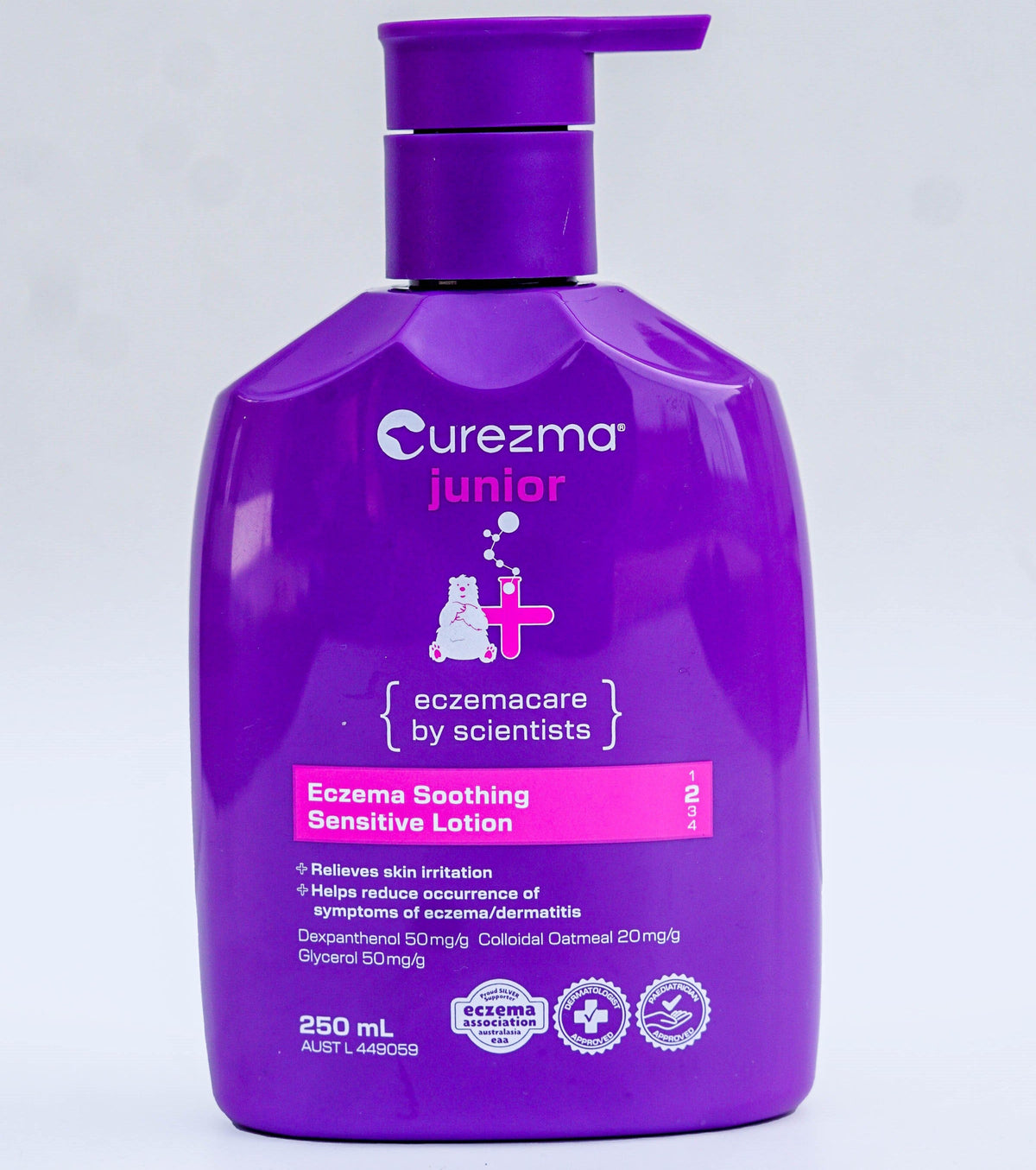 Purple bottle of Curezma Junior Eczema Soothing Sensitive Lotion on a light gray background