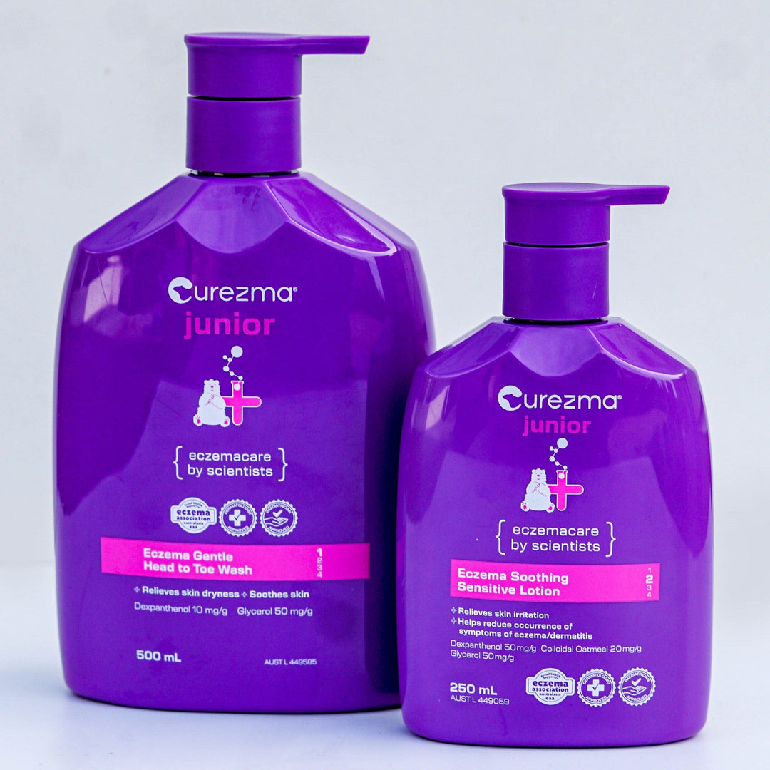 Two purple bottles of Curezma Junior on a light gray background